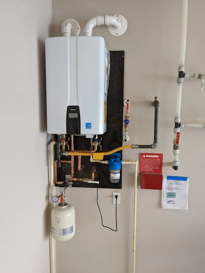 Professional plumber installing copper piping in a Clewiston home